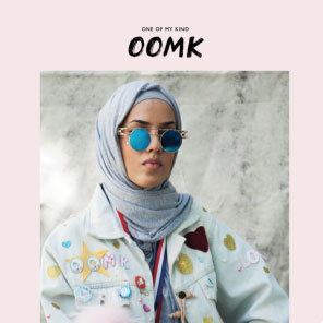 OOMK magazine cover with a picture of a woman