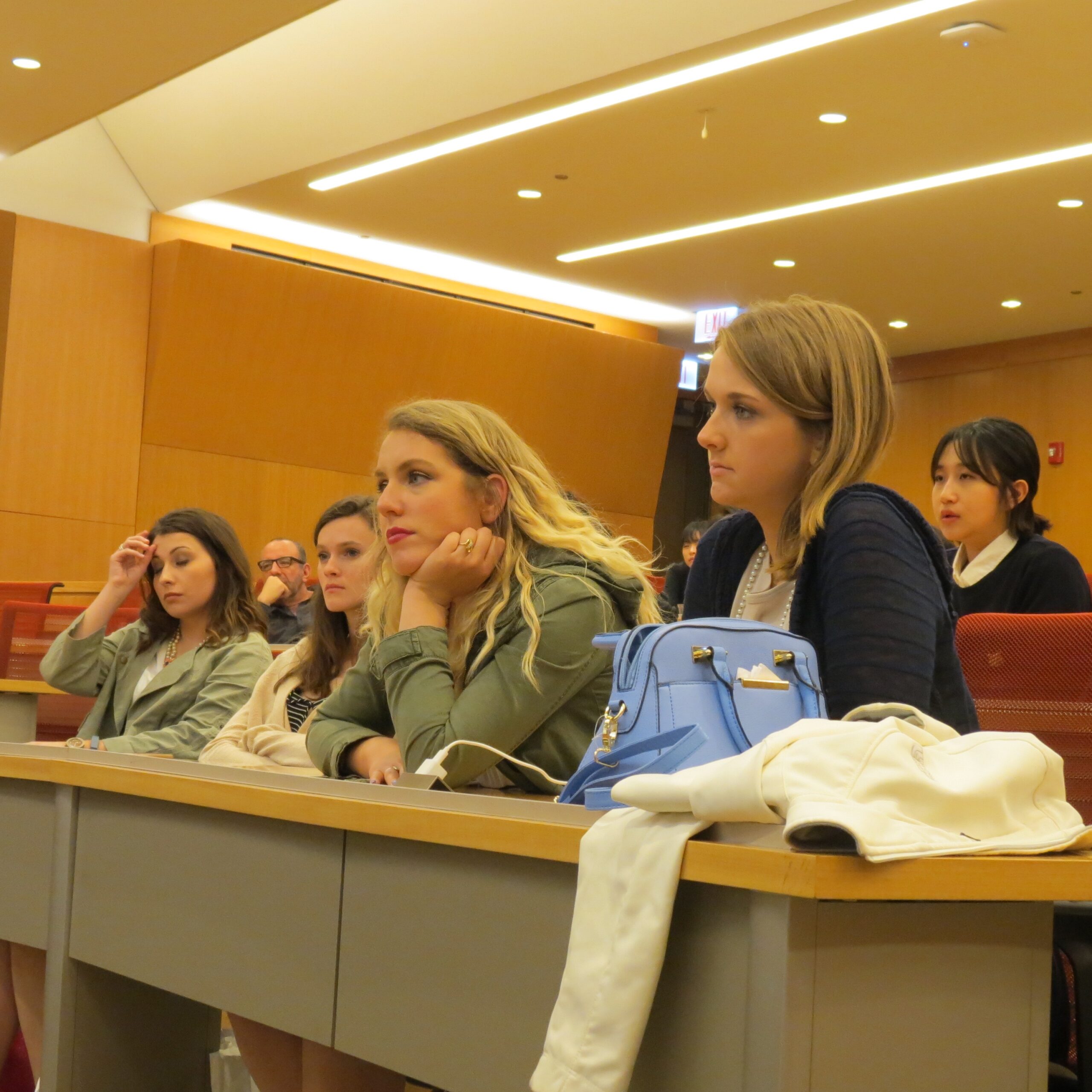 students listen to presentation in lecture hall