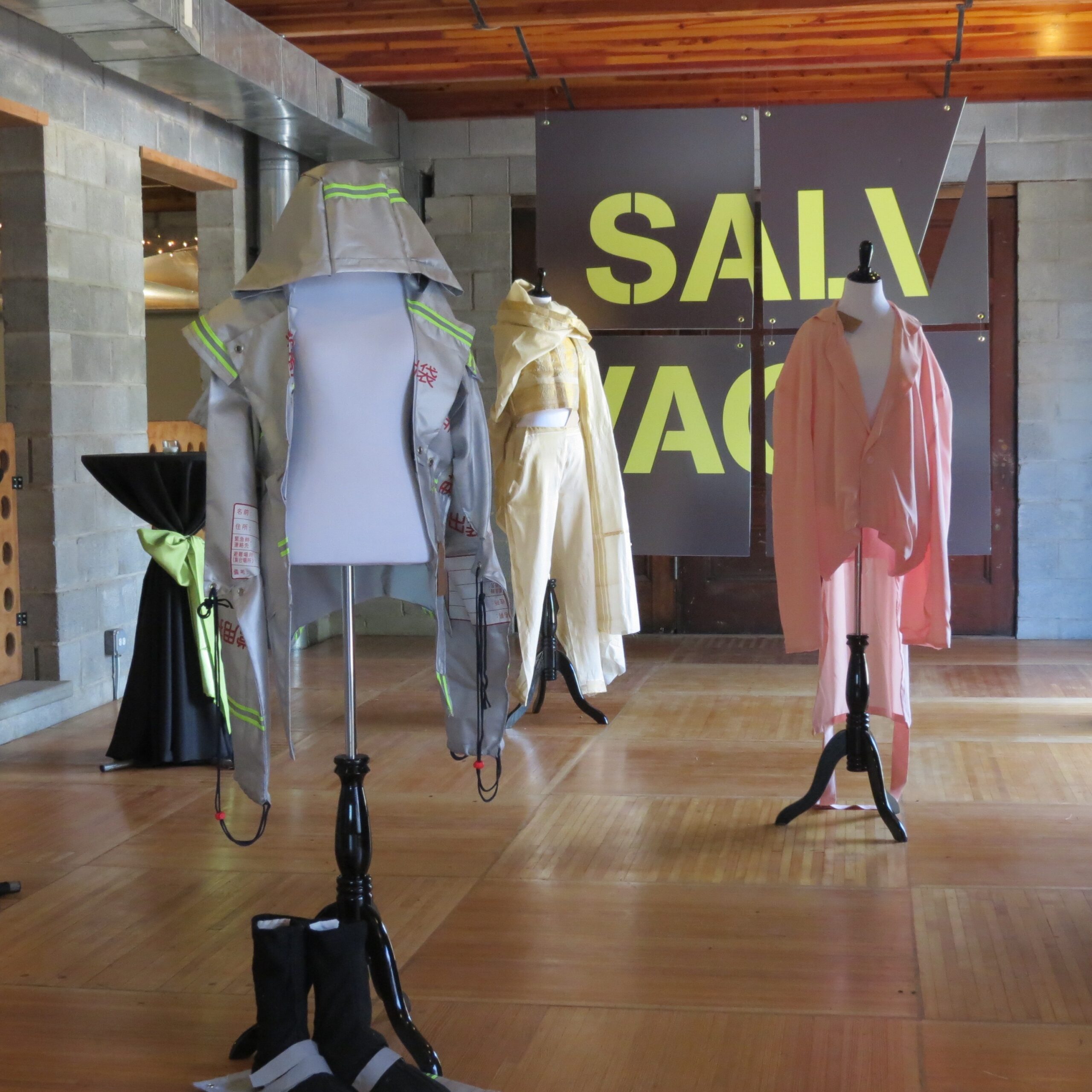 three dressed up mannequins spaced within a room with 