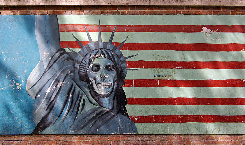 mural featuring skeleton statue of liberty against an American flag