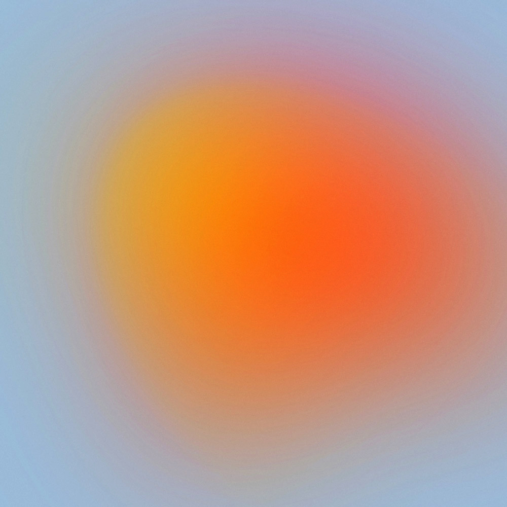 blurry yellow-orange circle against a pale blue background