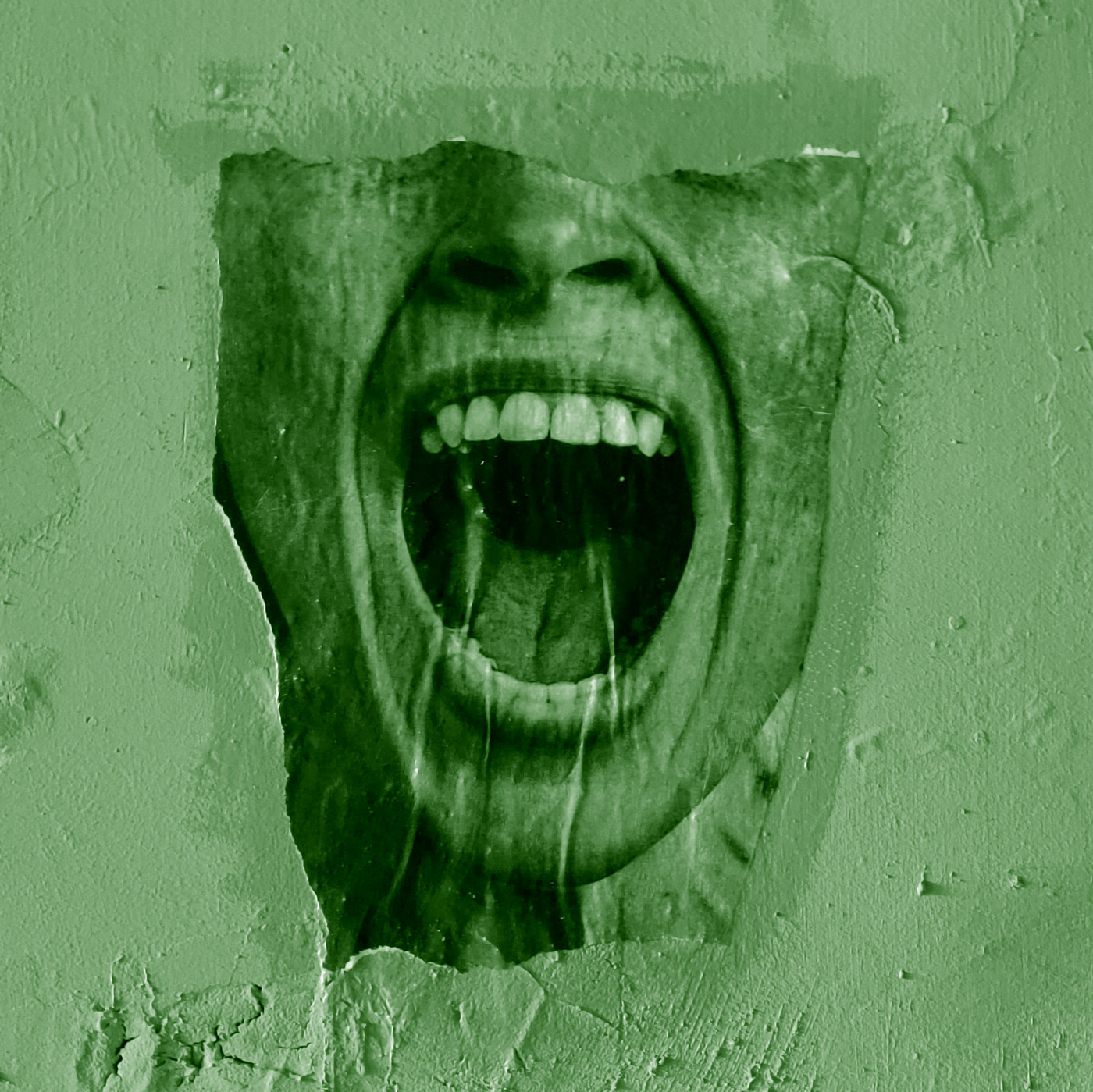 green-tinted photograph of a torn picture of a mouth pasted to a roughly textured wall