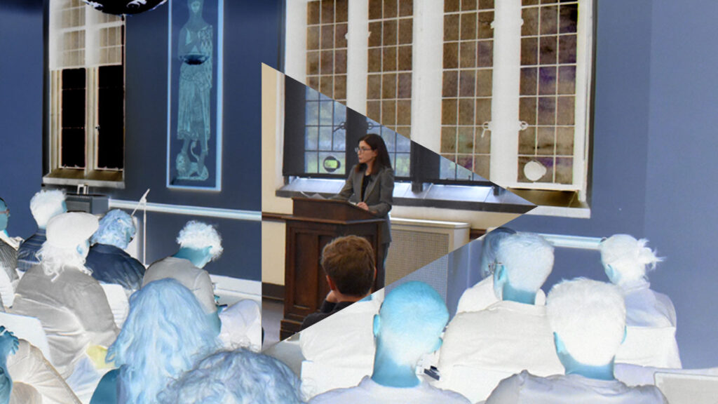 Linda Zerilli speaking at a podium
